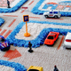 Illustration for article titled 3D Carpet Playmats Keep Hot Wheels Cars Safely On the Road
